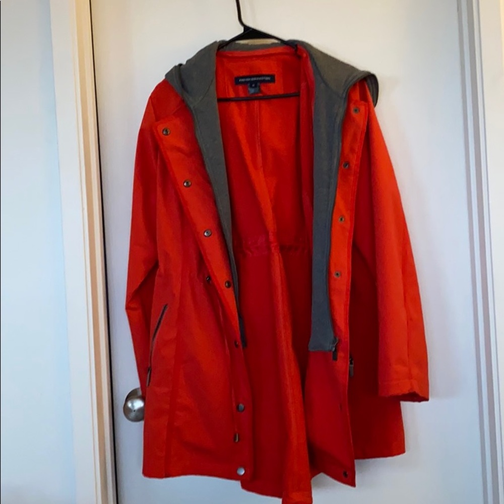 Hooded poppy colored jacket; removable hood.
